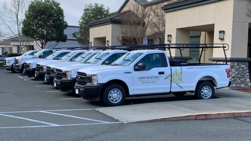 Long Electric fleet of trucks parked